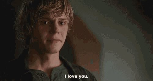 a young man is crying and saying i love you .
