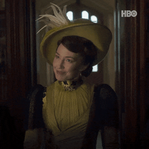 a woman in a yellow dress and hat says i don 't mean to interrupt