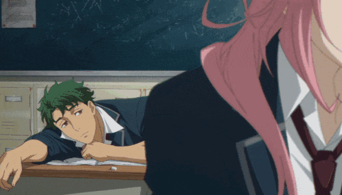 a girl with pink hair is looking at a boy with green hair laying at a desk