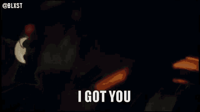 a woman with red hair is being kissed by a man and the caption says " i got you "