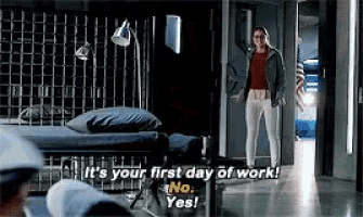 a woman is standing in a room and says it 's your first day of work no yes