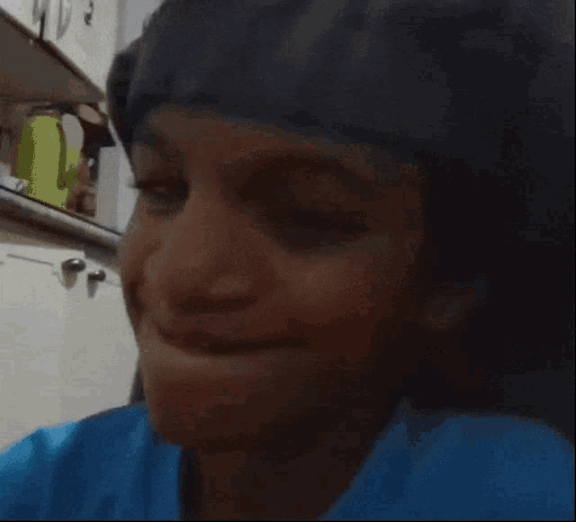a close up of a person 's face with their mouth open