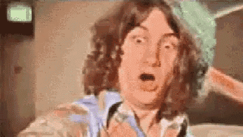a pixelated image of a man with a surprised expression on his face