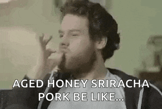 a man with a beard is eating pork and saying `` aged honey sriracha pork be like '' .