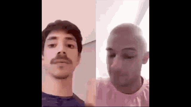 two men are standing next to each other and looking at the camera .