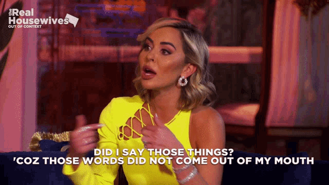 a woman in a yellow top says " did i say those things cuz those words did not come out of my mouth "