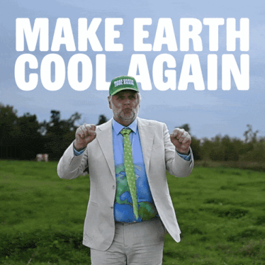 a man in a suit and tie is standing in a field with the words make earth cool again behind him
