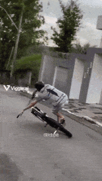 a man is riding a motorcycle down a street with a viggle.ai watermark in the corner