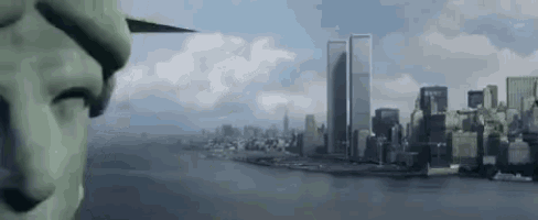 a statue of liberty is looking out over a city with two twin towers in the distance .