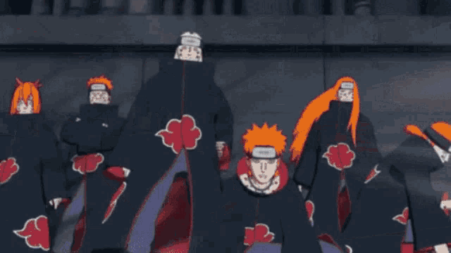 a cartoon character with a red cape is holding a scroll that says ' naruto ' on it