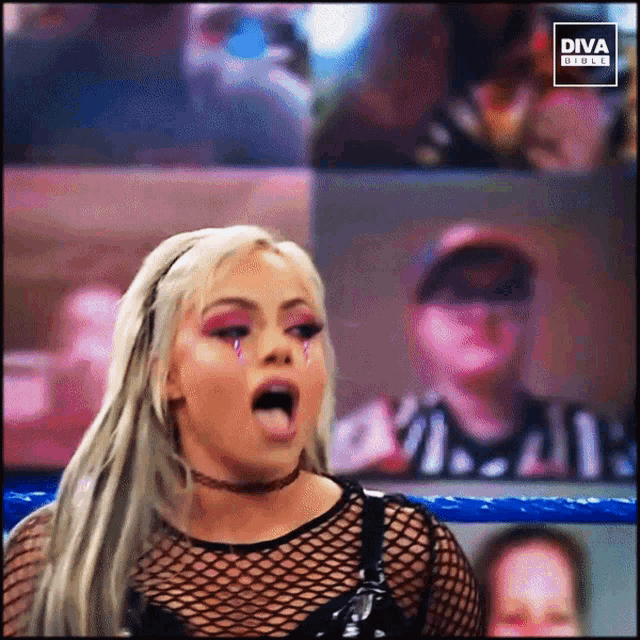 a woman is making a funny face in front of a diva direct sign