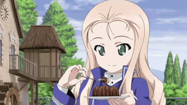 a girl in a blue jacket is eating a piece of cake with a fork