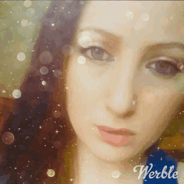 a close up of a woman 's face with the word werble on the bottom right