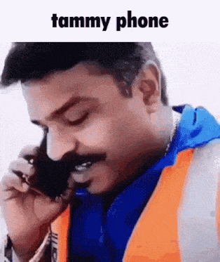 a man with a mustache is talking on a cell phone with the caption tammy phone