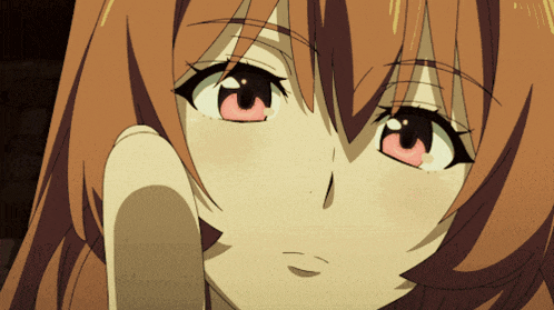 a close up of a girl 's face with her hand on her chin