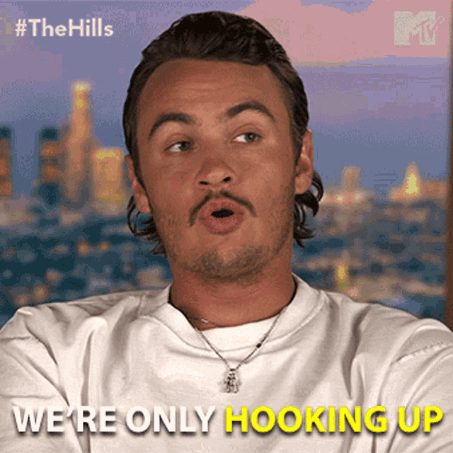 a man with a mustache is wearing a white shirt and a necklace and says we 're only hooking up