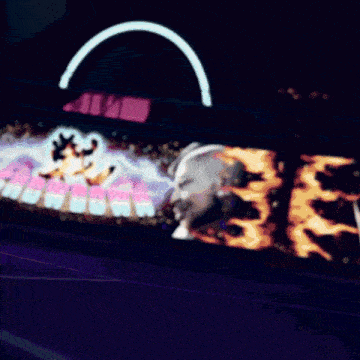 a blurred image of a person standing in front of a box of j col