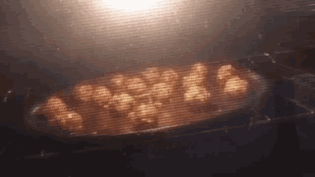 a bunch of nuts are being cooked in an oven