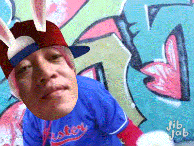 a man wearing a bunny hat and a easter jersey