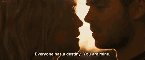 a man and a woman are kissing with the words everyone has a destiny you are mine