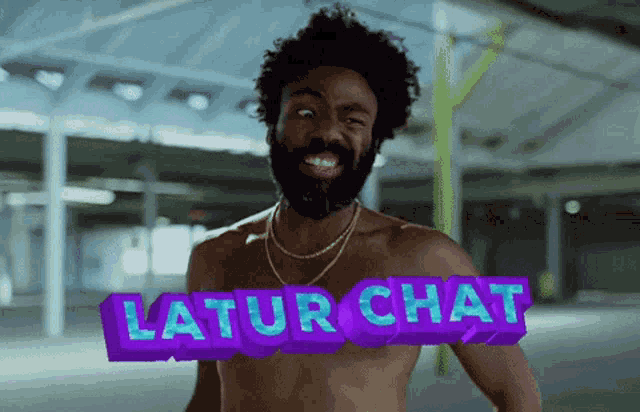 a shirtless man with a beard is smiling in front of a sign that says latur chat