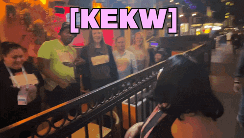 a group of people are standing in front of a sign that says ' kekw '