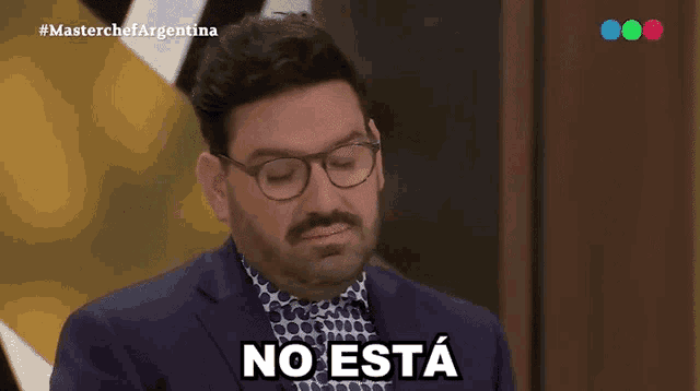 a man with glasses and a mustache says no esta