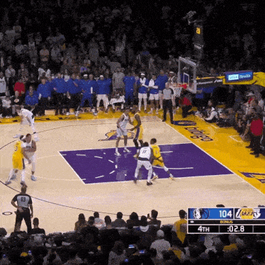 a basketball game between the dallas mavericks and the los angeles lakers is going on