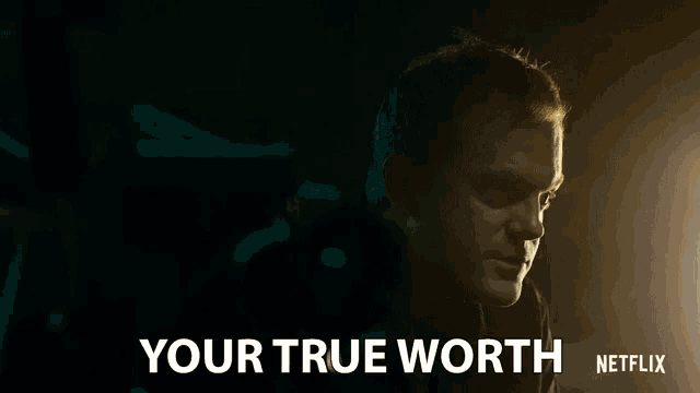 a man in a dark room with the words your true worth netflix on the bottom