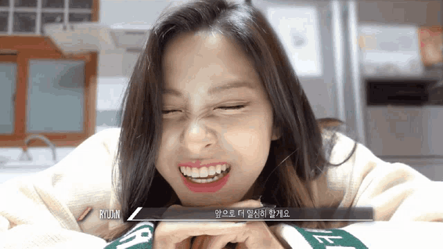 a girl making a funny face with ryujin written on the bottom