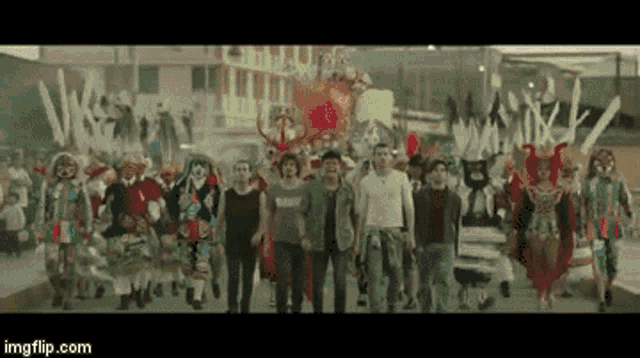 a group of people in colorful costumes are walking down the street