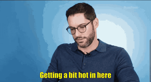 a man with glasses and a beard says getting a bit hot in here