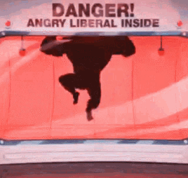 a sign that says danger angry liberal inside on it