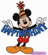 mickey mouse is wearing a party hat and holding a happy birthday sign