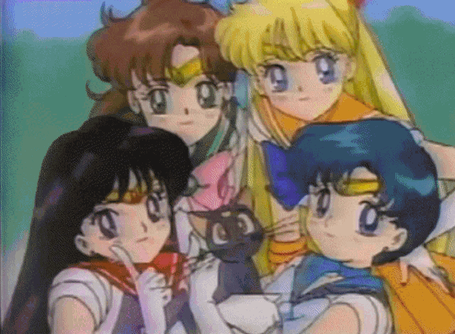 a group of anime girls are posing for a picture