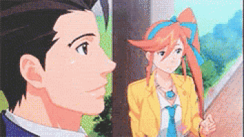 a man and a woman are standing next to each other in an anime .