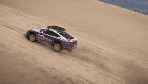 a blue and white roughroads porsche is driving on a dirt road