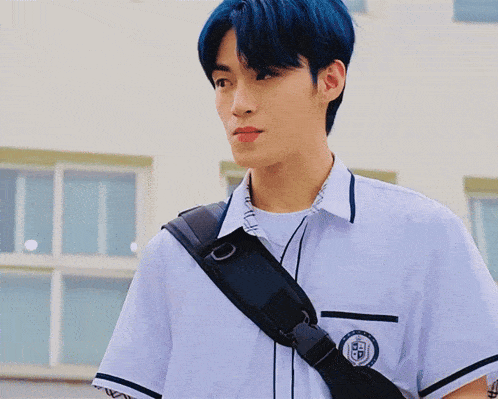 a boy with blue hair is wearing a school uniform and carrying a black purse