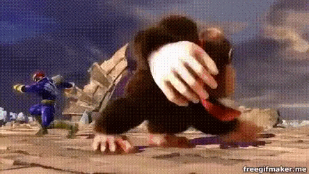 a cartoon monkey is crawling on the ground in a video game while a man in a purple suit is running .