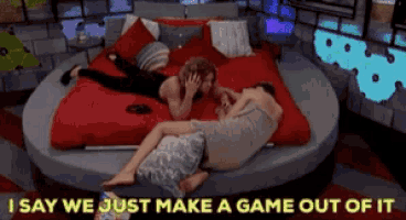 a couple laying on a bed with the words " i say we just make a game out of it "