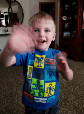 a young boy wearing a blue robots shirt