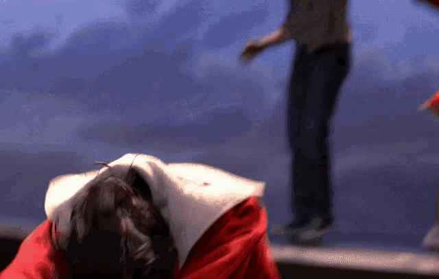 a person in a santa suit is laying on their back