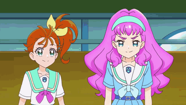 a girl with pink hair and a girl with orange hair are standing next to each other