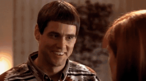 a man and a woman are smiling at each other .