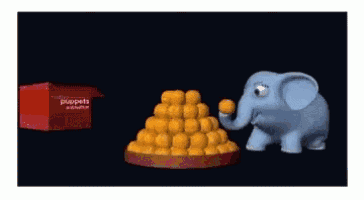 a cartoon elephant standing next to a pile of food and a box that says instant puppets