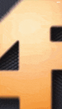 a close up of a number four on a black background