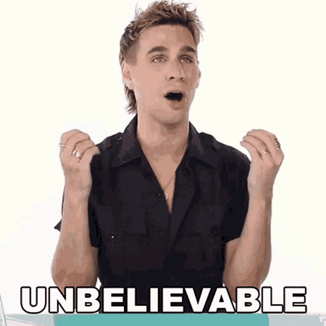 a man in a black shirt is making an unbelievable gesture with his hands in the air