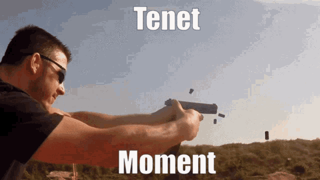 a man holding a gun with the words tenet moment written on the bottom
