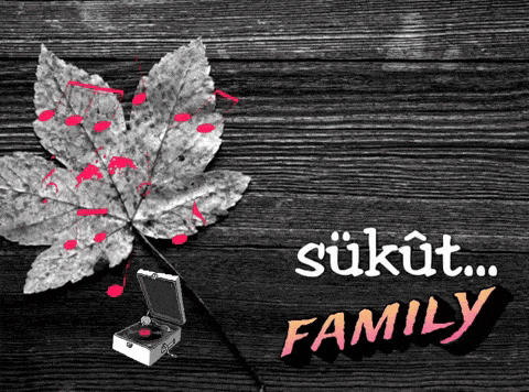 a black and white photo of a leaf and a record player with the words sukut family below it