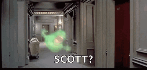 a ghost is coming out of a doorway in a hallway and says `` scott '' .